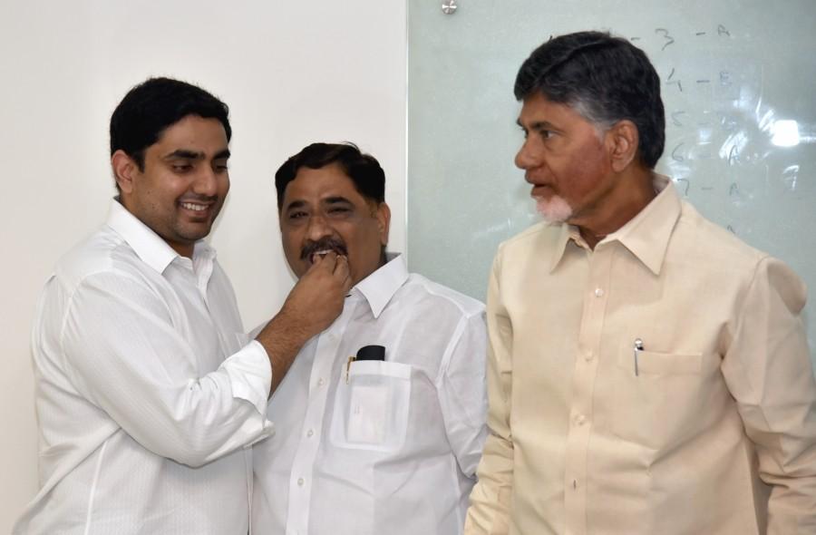 Andhra Pradesh Minister for Information and Housing Kaluva Srinivasulu along with Andhra Pradesh Scheduled Castes co-operative Finance Corporation (APSCCFC) chairman Jupudi Prabhakar Rao greet Andhra Pradesh Chief Minister N. Chandrababu Naidu on winning the Nandyal bypolls at the Chief Ministers residence in Vundavalli. Chandrababu Naidu,Chandrababu Naidu celebrates Nandyal bypolls,Nandyal bypolls,CM Chandrababu Naidu,APSCCFC,Andhra Pradesh Scheduled Castes co-operative Finance Corporation