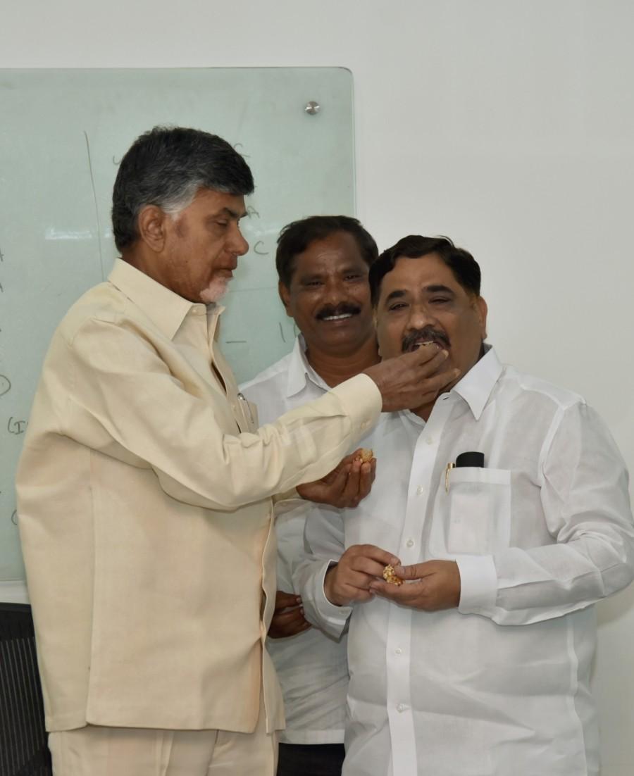 Andhra Pradesh Minister for Information and Housing Kaluva Srinivasulu along with Andhra Pradesh Scheduled Castes co-operative Finance Corporation (APSCCFC) chairman Jupudi Prabhakar Rao greet Andhra Pradesh Chief Minister N. Chandrababu Naidu on winning the Nandyal bypolls at the Chief Ministers residence in Vundavalli, Andhra Pradesh on Aug 29, 2017. Chandrababu Naidu,Chandrababu Naidu celebrates Nandyal bypolls,Nandyal bypolls,CM Chandrababu Naidu,APSCCFC,Andhra Pradesh Scheduled Castes co-operative Finance Corporation