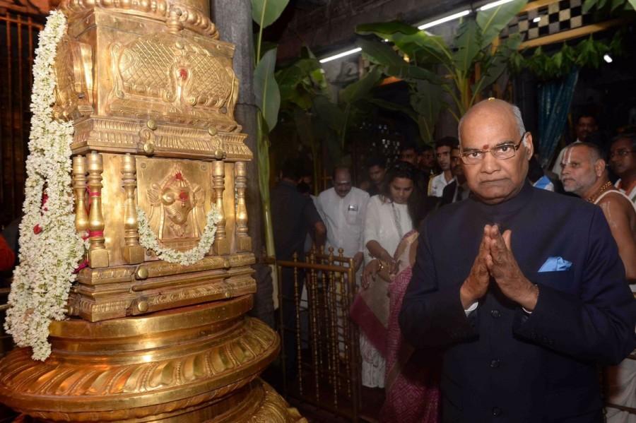 President Ram Nath Kovind, accompanied by his wife and other family members, on Saturday offered prayers at the famous Lord Sri Venkateswara temple at Tirumala in Andhra Pradesh. This was Kovind's first visit to the hill shrine after assuming office as the country's President last month. The President and his family members spent about half an hour in the temple, participating in various rituals. President Ram Nath Kovind,Ram Nath Kovind,Ram Nath Kovind Tirupati temple,Ram Nath Kovind at Tirupati temple,Kovind at Tirupati temple,Lord Sri Venkateswara temple,Tirumala