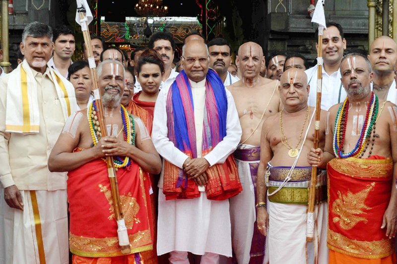 Andhra Pradesh Chief Minister N. Chandrababu Naidu and Governor E.S.L. Narasimhan accompanied Kovind. According to the Tirumala Tirupati Devasthanam (TTD), which manages the affairs of the ancient temple, the President offered prayers in Bhu Varaha Swamy temple and later reached Tirumala temple. He was welcomed by TTD Executive Officer Anil Kumar Singhal and other officials while the Veda pundits offered 'Isthikaphal Swagatham' to the first citizen of the country with temple honours. President Ram Nath Kovind,Ram Nath Kovind,Ram Nath Kovind Tirupati temple,Ram Nath Kovind at Tirupati temple,Kovind at Tirupati temple,Lord Sri Venkateswara temple,Tirumala