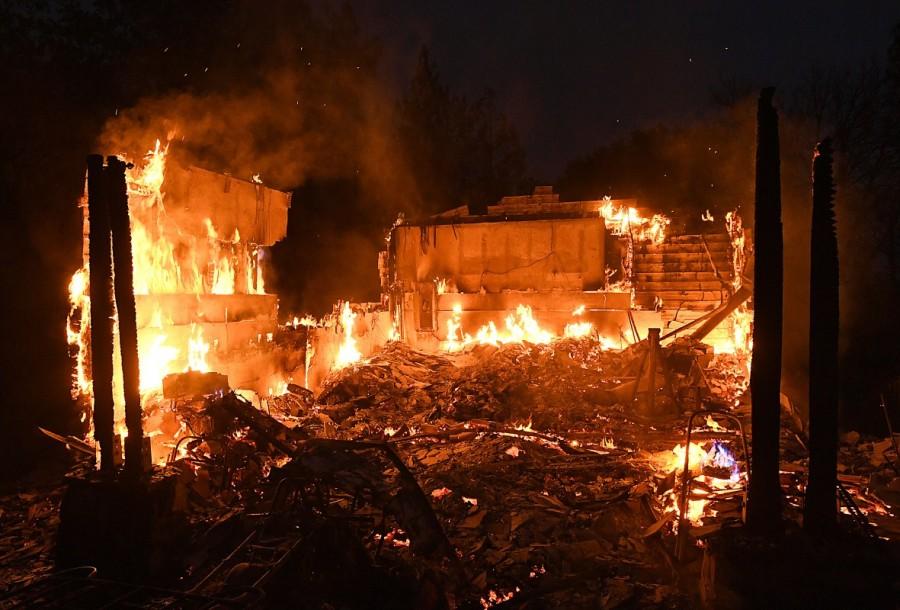 A fast-moving wildfire that destroyed homes and forced the evacuation of some residents in Northern California continued to grow on Wednesday, local media and fire officials said. Fast-moving wildfire,wildfire,wildfire in Northern California,Northern California,California,California wildfire