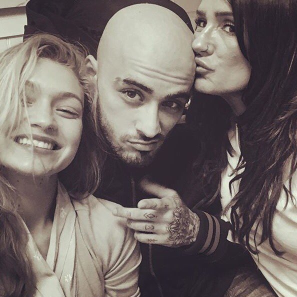 Singer-songwriter Zayn Malik, known for making some drastic hair moves, has gone bald. On September 3, Zayn's mother Trish Malik shared an Instagram photo of herself, her son and his girlfriend Gigi Hadid. The black-and-white image shows the "Pillowtalk" hitmaker with a bald head and stubble, reports eonline.com. Zayn Malik,Singer Zayn Malik,Zayn Malik goes bald,Zayn Malik bald pics,Zayn Malik bald images,Zayn Malik bald stills,Zayn Malik bald pictures,Zayn Malik bald photos