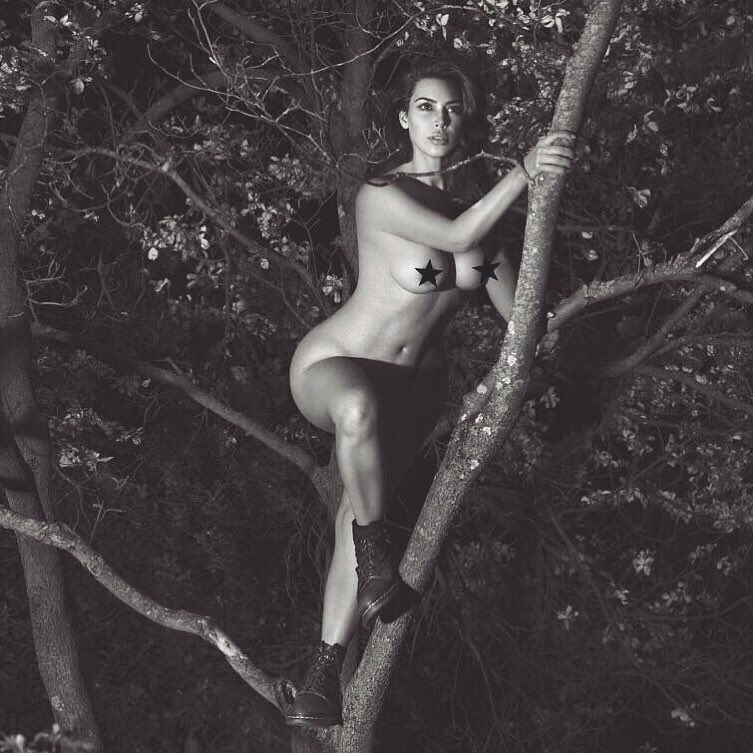 The black-and-white image that she has shared on social media shows Kim wearing only a pair of black boots as she climbs a tree, reports aceshowbiz.com. The reality TV star, 36, has placed her legs to prevent exposing her body parts. She has concealed her nipples in the photo with a pair of star emoticons. "So honoured to have been photographed by Mert and Marcus for their new book! 20 years in the making! It's out on September 7 in NYC," she captioned the image. Kim's nude photograph comes just days after TV host Sharon Osbourne slammed her for sharing nude selfies in the name of feminism. Kim Kardashian,Kim Kardashian nude,Kardashian nude pose,Kardashian naked,Kim Kardashian photoshoot,Kim Kardashian nude photoshoot