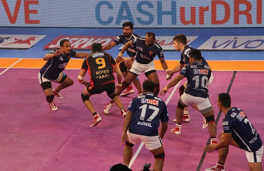 Dabang Delhi came from behind to beat Bengaluru Bulls 38-30 and log their second consecutive win in a Inter Zone challenge of the Pro-Kabaddi League (PKL) at the Netaji Subhas Chandra Bose Indoor Stadium on Wednesday. In what was a see-saw battle from start to finish, Bengaluru threw away their halftime lead of 18-12 as Delhi rode their captain Meraj Sheykh's superlative show to register their fourth win in the tournament in nine games. Delhi are now on 24 points. Bengaluru remained fourth with 23 points from 11 outings. Pro Kabaddi 2017,Pro Kabaddi,Bengaluru Bulls,Dabang Delhi,Dabang Delhi crush Bengaluru Bulls,Dabang Delhi beats Bengaluru Bulls