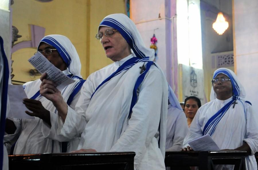 Vatican's ambassador to India, Giambattista Diquattro (C) led a Mass and inaugurates a bronze statue in the church of Mother Teresa carrying a child at a cathedral in Kolkata on 6th Sept 2017. Mother Teresa,saint Mother Teresa,Mother Teresa bronze statue,Mother Teresa statue