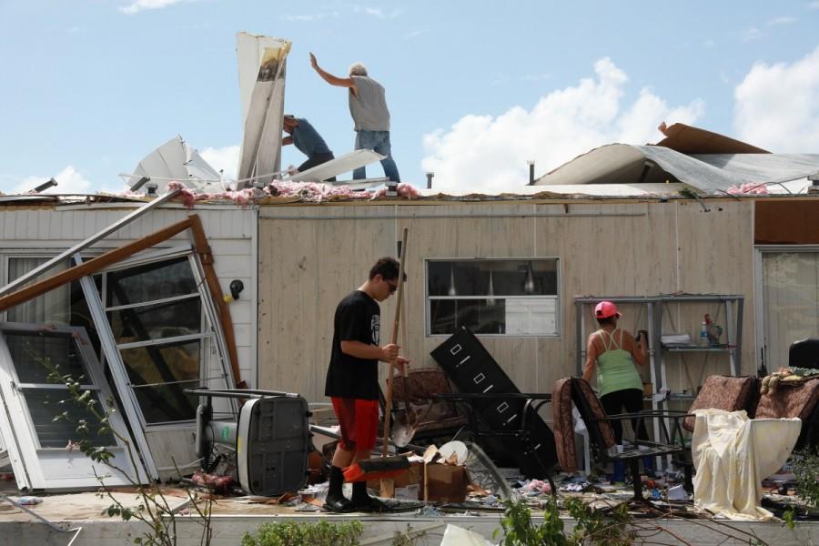 Olga Teakell, on right, and her family clean her mobile home in Naples. Hurricane Irma,Florida Hurricane Irma,devastation in Florida