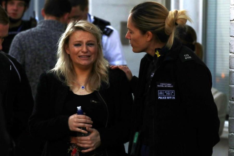 A woman reacts outside Parsons Green tube station in London. London underground,London Underground explosion,london underground,London underground blast,London Underground Station,Blast at London underground