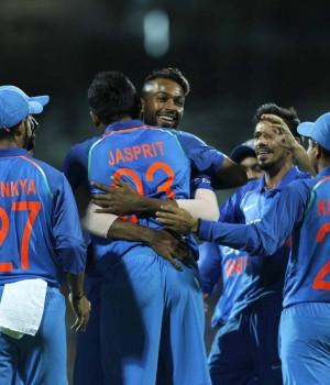 India rode on MS Dhoni and Hardik Pandya's all-round brilliance to thrash Australia by 26 runs by Duckworth-Lewis method in a rain-truncated opener of the five-match One-day International series at the M.A. Chidambaram Stadium here on Sunday. After guiding India to safety with a career-best 83 off 66 balls, the 23-year-old Pandya starred with the ball, picking the key wickets of Australia skipper Steve Smith (1) and Travis Head (5) to enable the hosts go 1-0 up in the series. Chasing a revised target of 164 from 21 overs after a spell of heavy showers truncated play, Australia were reduced to 29/3 with debutant opener Hilton Cartwright (1), Smith and Head back in the pavilion. Such was India's domination in the second innings of the match that only three of the visiting batsmen could manage to reach double-figures and Australia were restricted to 137/9.