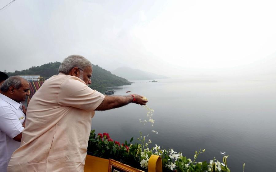 Prime Minister Narendra Modi inaugurated the ambitious 138 metre inter-state Sardar Sarovar Dam project on Narmada river on his 67th birthday on Sunday, linking it with his "mission" to create a new India and roared: "I will live for your dreams, I will die for your dreams." The Prime Minister, who was expected to reach the dam site at Kevadiya Colony around 9.15 a.m. from Gandhinagar after receiving blessings from his octogenarian mother Heeraba, had to take a de tour due to bad weather. He landed in Dabhoi and travelled to Kevadiya Colony by car, reaching a little over an hour later. PM Narendra Modi,Narendra Modi,Modi inaugurates Narmada dam,Narmada dam,Narendra Modi inaugurates Narmada dam,Sardar Sarovar Dam project