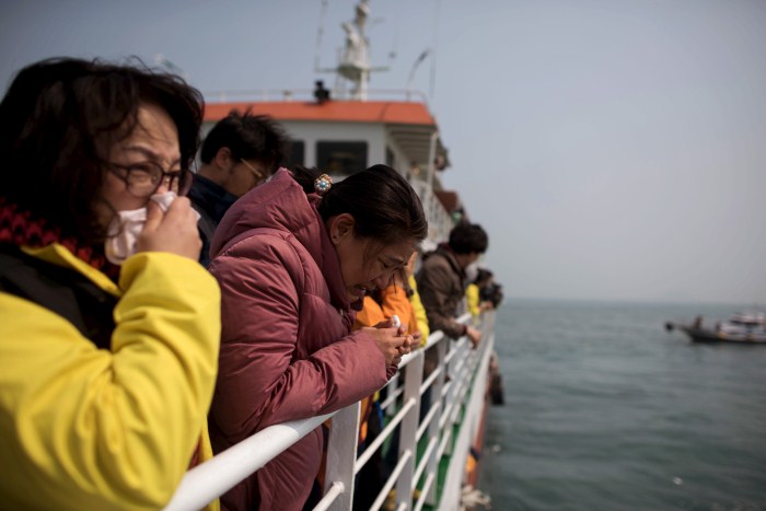A relative of the victims of the Sewol disaster weeps during a ceremony on the eve of the first anniversary South Korea Grieves On Anniversary Of Sewol Ferry Disaster,Sewol disaster,Sewol Ferry Disaster,first anniversary of the Sewol ferry disaster,South Korea