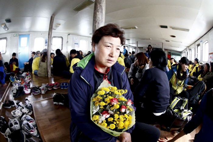 A relative of the victims of the Sewol disaster weeps during a ceremony on the eve of the first anniversary South Korea Grieves On Anniversary Of Sewol Ferry Disaster,Sewol disaster,Sewol Ferry Disaster,first anniversary of the Sewol ferry disaster,South Korea