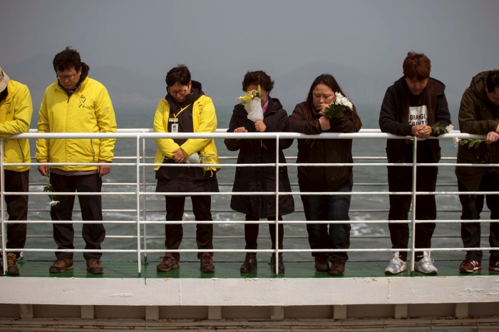 A relative of the victims of the Sewol disaster weeps during a ceremony on the eve of the first anniversary South Korea Grieves On Anniversary Of Sewol Ferry Disaster,Sewol disaster,Sewol Ferry Disaster,first anniversary of the Sewol ferry disaster,South Korea