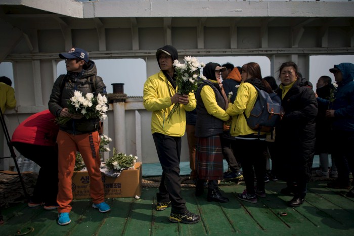 A relative of the victims of the Sewol disaster weeps during a ceremony on the eve of the first anniversary South Korea Grieves On Anniversary Of Sewol Ferry Disaster,Sewol disaster,Sewol Ferry Disaster,first anniversary of the Sewol ferry disaster,South Korea
