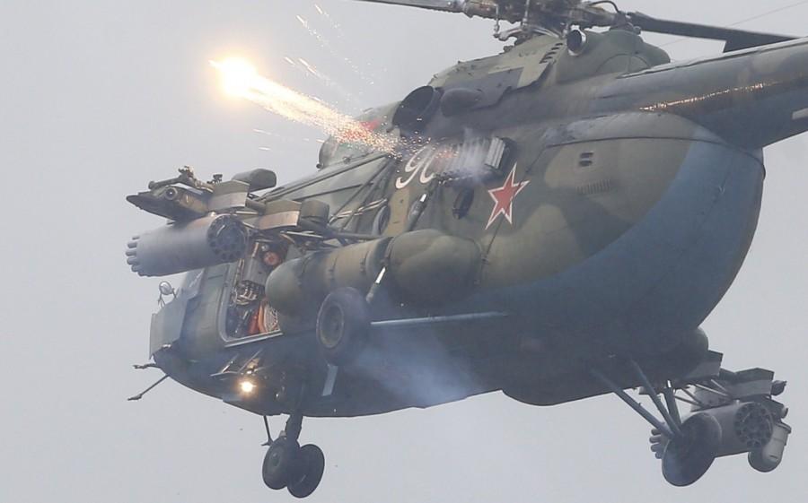 Crew members operate a Belarussian Mi-8 helicopter during the Zapad-2017 war games, held by Russian and Belarussian servicemen, outside the town of Ruzhany in Belarus. Russian war games,Russian war,Russia’s biggest war games,Russian war games rattle West,Mi-8 helicopter,Vladimir Putin