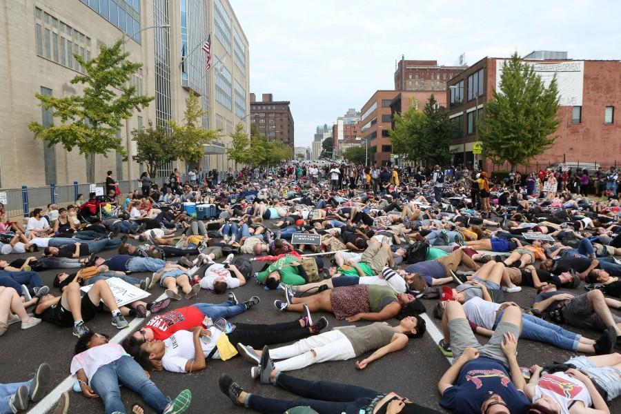 Protesters stage a "die-in" during a peaceful rally outside the police headquarters after the not guilty verdict in the murder trial of Jason Stockley, a former St. Louis police officer charged with the 2011 shooting of Anthony Lamar Smith, in St. Louis, Missouri, U.S. September 17, 2017. Picture taken September 17, 2017. St. Louis Justice Center,St. Louis Justice,Protests in St. Louis,Protests at St. Louis,Jason Stockley,St. Louis police officer Jason Stockley,Anthony Lamar Smith