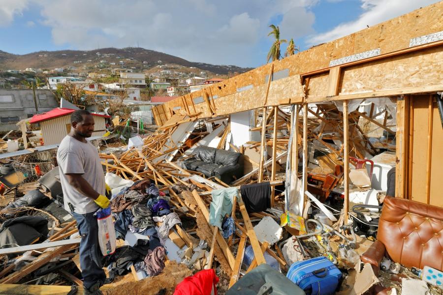 A resident of the Frenchtown district surveys his home in Charlotte Amalie, St. Thomas. U.S. Virgin,Irma aftermath,U.S. Virgin Islands,Hurricane Irma