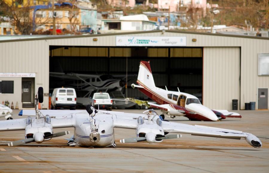 A private plane flipped by Hurricane Irma lies near another also damaged by the storm in a parking area of Cyril E. King Airport in Charlotte Amalie, St. Thomas. U.S. Virgin,Irma aftermath,U.S. Virgin Islands,Hurricane Irma