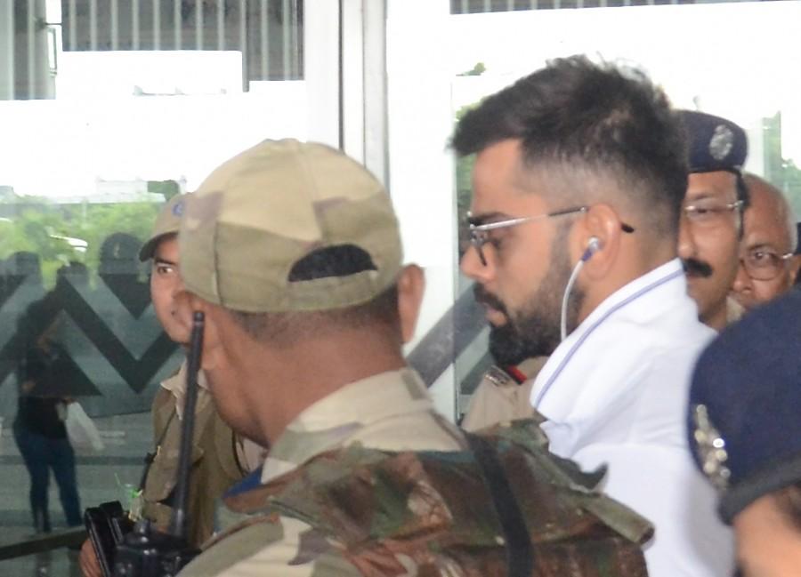 Virat Kohli arrives at Netaji Subhas Chandra Bose International Airport in Kolkata on Sept 18, 2017. India vs Australia,India vs Australia 2017,India vs Australia 2nd ODI,Steve Smith,Virat Kohli,Hardik Pandya,MS Dhoni