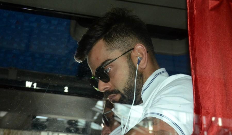 Indian skipper Virat Kohli arrives at Netaji Subhas Chandra Bose International Airport in Kolkata on Sept 18, 2017. India vs Australia,India vs Australia 2017,India vs Australia 2nd ODI,Steve Smith,Virat Kohli,Hardik Pandya,MS Dhoni