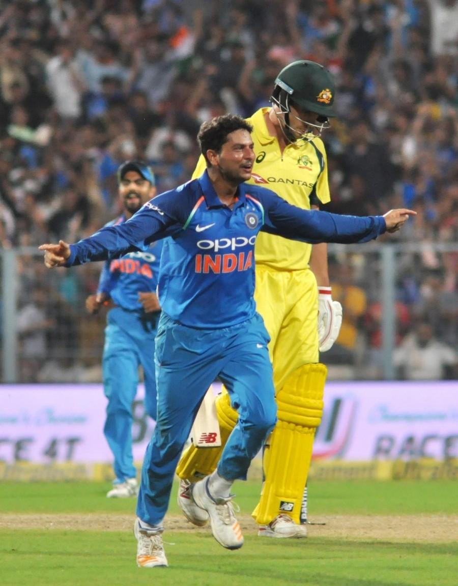 Chinaman Kuldeep Yadav bagged a hat-trick as India rode a dominant bowling performance to restrict Australia to 202 and win the second One Day International (ODI) by 50 runs at the Eden Gardens here on Thursday. In three successive deliveries, Kuldeep (3/54) took the wickets of Mathew Wade, Ashton Agar and Pat Cummins in the 33rd over to become the second bowler in limited overs cricket to script a hat-trick at this venue and only the third Indian to record the rare feat in 50 overs cricket. The other Indians to get hat-tricks are Kapil Dev and Chetan Sharma, with Dev grabbing his treble at the Eden against Sri Lanka in 1991. Sharma bagged it in 1987. Besides Kuldeep, Bhuvneshwar Kumar (3/9), Yuzvendra Chahal (2/34) and all-rounder Hardik Pandya (2/56) starred with the ball for the hosts as Steve Smith (59) and Marcus Stoinis (62 not out) scored half-centuries for the tourists. Chinaman Kuldeep Yadav,Chinaman Kuldeep Yadav gets hat-trick,Chinaman Kuldeep Yadav hat-trick,Kuldeep gets hat-trick,India beat Australia in second ODI,India beat Australia