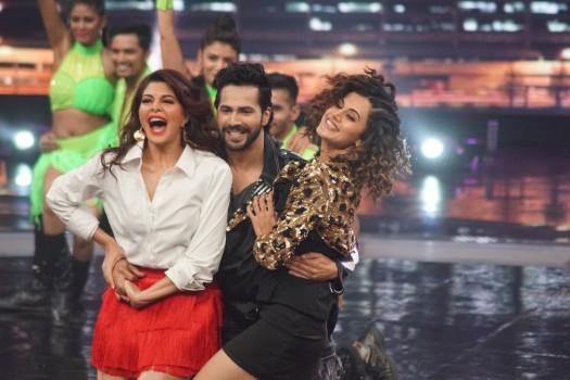 Actors Taapsee Pannu, Varun Dhawan and Jacqueline Fernandez perform during the promotion of their upcoming film 
