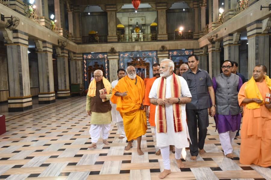Prime Minister Narendra Modi on Friday evening visited the famous Tulsi Manas and Durga Kund temples here and offered his prayers. Accompanied by Uttar Pradesh Governor Ram Naik and Chief Minister Yogi Adityanath, Modi sought to know detailed information about the Manas temple, which was inaugurated by then President Sarvapalli Radhakrishnan in 1964. Narendra Modi,PM Narendra Modi,Prime Minister Narendra Modi,Narendra Modi offers prayers at Tulsi Manas,Modi at Durga Kund