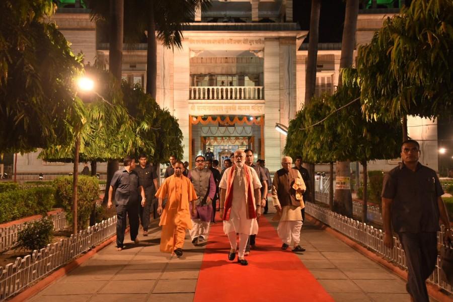 Modi was informed by its priests of the temple that it was built by King Sudarshan and was renovated in the 17th century by Queen Bhawani. Narendra Modi,PM Narendra Modi,Prime Minister Narendra Modi,Narendra Modi offers prayers at Tulsi Manas,Modi at Durga Kund