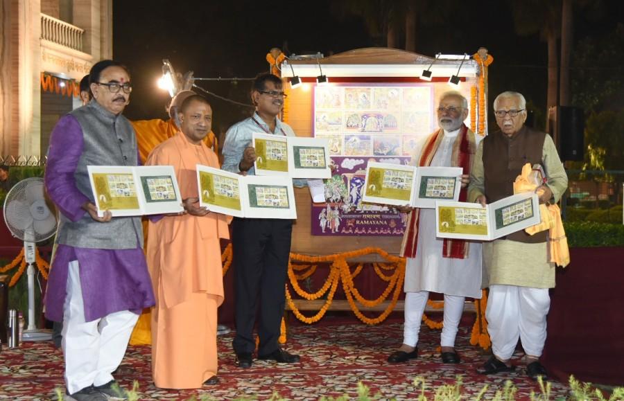 Prime Minister Narendra Modi releases a postal stamp on "Ramayana" during his visit to Tulsi Manas Temple in Varanasi on Sept 22, 2017. Also seen The Uttar Pradesh Governor Ram Naik and the Chief Minister Yogi Adityanath. Prime Minister Narendra Modi,Narendra Modi,Ramayana,postal stamp on Ramayana,Ramayana postal stamp,Modi in Varanasi