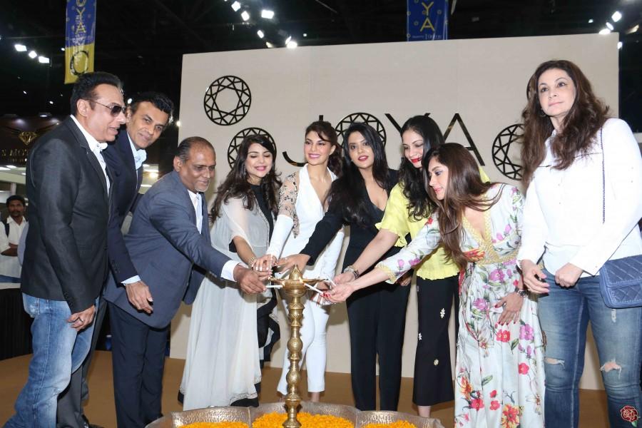 Jacqueline Fernandes, Amruta Fadnavis, Yes Bank's Radha Kapoor lit the lamp and launched JOYA - a fashion and lifestyle exhibition in Mumbai. Jacqueline Fernandes,Amruta Fadnavis,Yes Bank's Radha Kapoor,JOYA - a fashion and lifestyle exhibition