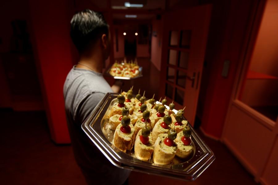 Asylum seeker Monjid from Syria brings food to visitors. Rooms cost 99-140 euros ($119-$168) a night. Each is decorated with a single word on the wall intended to invoke the many contradictions of the place: "Freedom?" Former Dutch prison,Dutch prison,Netherlands,prison now offers refuge as hotel