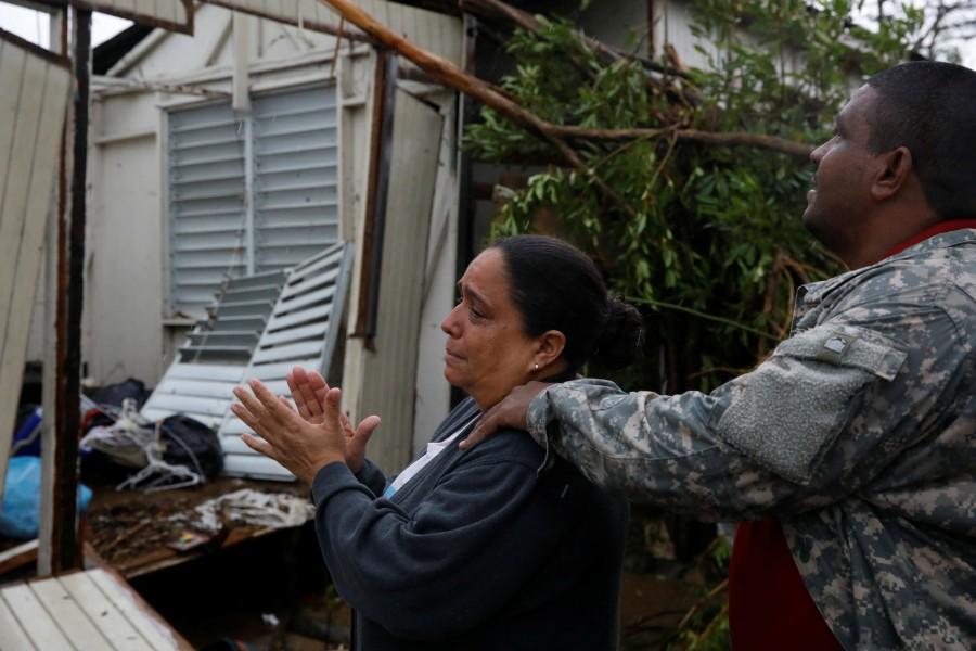 A woman reacts while she looks at the damage in the house of her mother in Guayama, Puerto Rico. Hurricane Maria,Hurricane Maria in Puerto Rico,Hurricane Maria slams Puerto Rico,U.S. territory