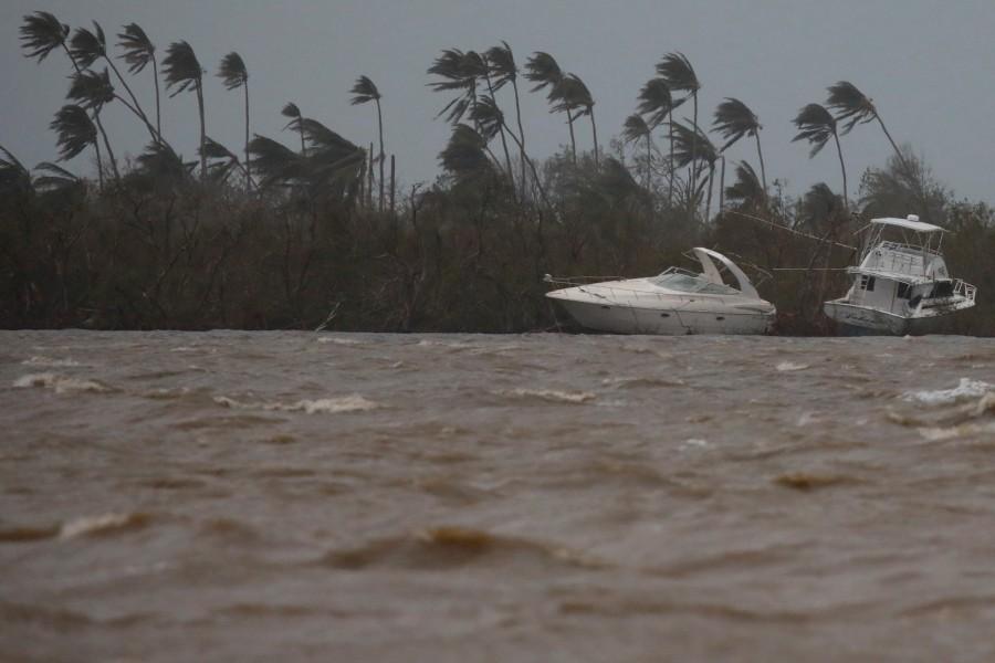 Damaged boats are seen in Puerto de Jobos, Puerto Rico. Hurricane Maria,Hurricane Maria in Puerto Rico,Hurricane Maria slams Puerto Rico,U.S. territory