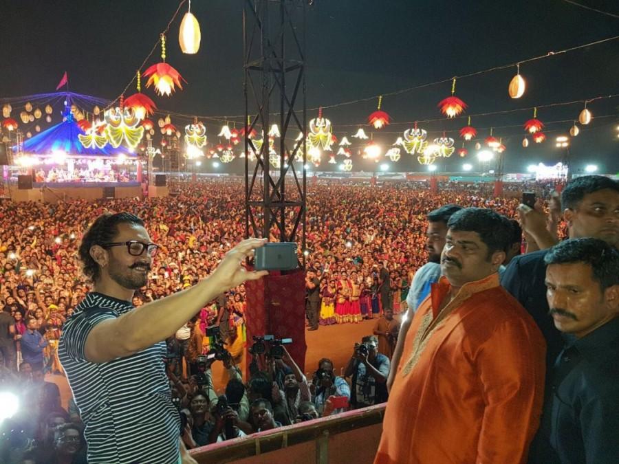 Superstar Aamir Khan celebrated the festival of Navratri in Baroda while he visited the city to promote his upcoming film 'Secret Superstar'. The actor along with his upcoming talent Tirth Sharma attended the Navratri festival on Sunday night in Baroda. Aamir Khan who is seen launching new 'Secret Superstars' with his upcoming film, visited Baroda to launch Tirth Sharma who will be seen playing the role of Chintan, a close friend of Insia played by Zaira Wasim. After director Advait Chandan and singer Meghna Mishra, Tirth Sharma is the third Secret Superstar that the film would unfold. Aamir Khan,Aamir Khan celebrates Navratri,Actor Aamir Khan celebrates Navratri,Secret Superstar,Secret Superstar team,Superstar Aamir Khan