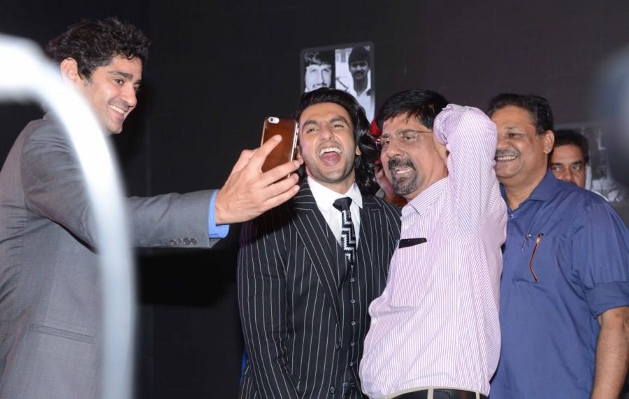 The actor was caught promoting the director Kabir Khan who was sitting amongst the audience to note down experiences shared by the players. The makers of the film announced that they were privileged and honoured to make a movie on 1983 world cup. '83 will bring to light one of the most important event in the Indian cricket history. 83 movie launch,83 movie,Kapil Dev,Ranveer Singh,Srikkanth,Amarnath