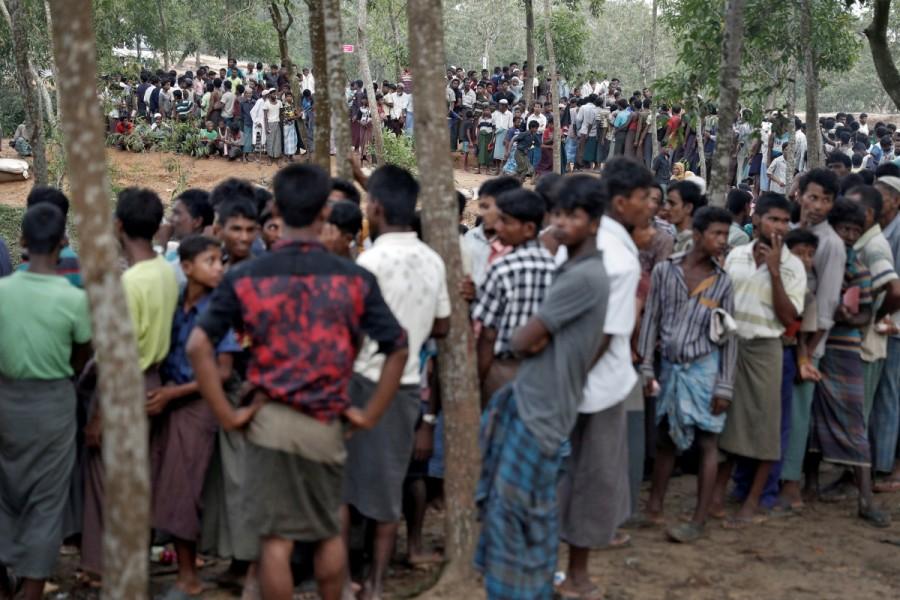 Rohingya refugees wait to receive aid in Cox's Bazar, Bangladesh. Rohingya,Rohingya flee Myanmar,Violence in Myanmar,480,000 Rohingya,refuge in Bangladesh
