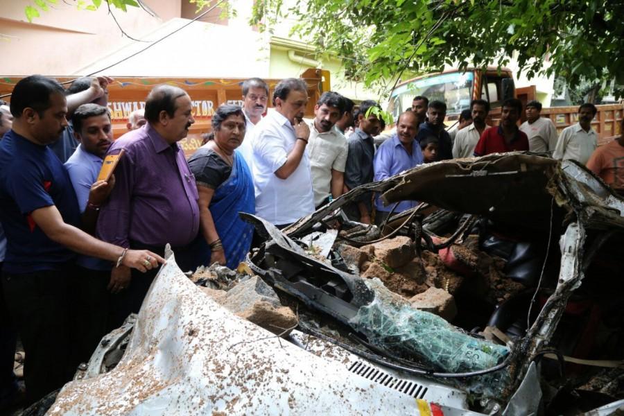 A view of a damaged four-wheeler after a compound wall collapsed due to heavy rains in Bengaluru on Sept 27, 2017. Heavy rain,Heavy rain in bangalore,Bangalore Heavy rain