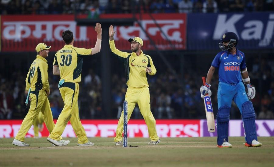 Pacer Kane Richardson played a crucial role for the Australians, picking up the key wickets of Rahane, Jadhav and the dangerous Dhoni. India, having already won the five-match series with victories in the first three ODIs, rested pacers Bhuvneshwar Kumar and Jasprit Bumrah and left-arm wrist spinner Kuldeep Yadav and brought in pacers Yadav and Mohammad Shami and left-arm spinner Axar Patel. Chasing a challenging target, India were off to a good start with Sharma and Rahane putting up an opening stand of 106 runs. Sharma was in excellent form, with five sixes and a boundary dotting his 55-ball innings which yielded 65 runs. Rahane gave him good support from the other end, scoring 53 runs off 66 balls with six boundaries and a hit into the stands. Australia beat India,Australia vs India,Australia beat India by 21 runs,Virat Kohli