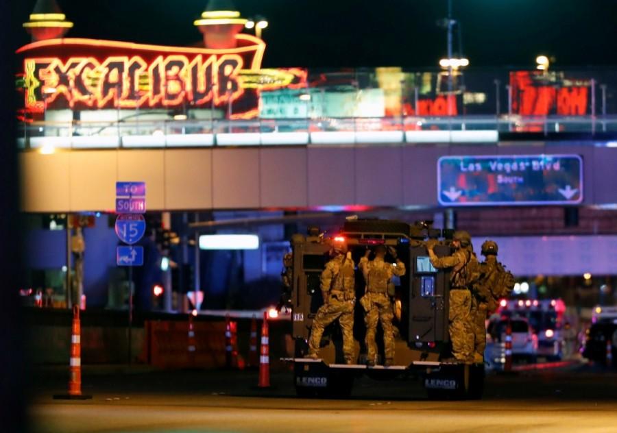 FBI agents ride an armored vehicle to a staging area on October 2, 2017, after a mass shooting during a music festival on the Las Vegas Strip in Las Vegas, Nevada. Las Vegas,Las Vegas shooting,Las Vegas Deadly Shooting,Deadly Shooting Las Vegas