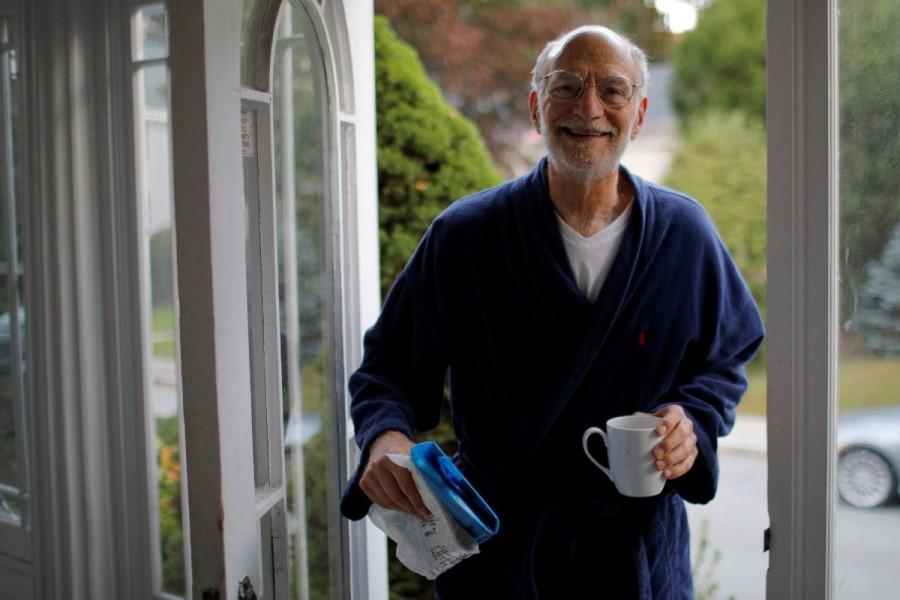 Michael Rosbash, a Brandeis University professor, retrieves the morning newspaper after learning he is one of the 2017 Nobel Prize in Physiology or Medicine winners, at his home in Newton, Massachusetts. Rosbash said the news that the trio had won the Nobel prize, which is worth 9 million Swedish crowns ($1.1 million), was "a little overwhelming ... It took my breath away, literally. I was woken up out of deep sleep and it was shocking," he told Reuters. "It's great for basic science. It hasn't had a tremendous amount of practical impact yet, so it's really a very basic discovery ... It's good to have the attention on this kind of basic work." Nobel prizes,Science,Science prizes,People in science,Biology,Michael Rosbash,Jeffrey C Hall,Michael W Young,Nobel prize,Nobel prize 2017,Nobel prize winner,Nobel prize 2017 winner