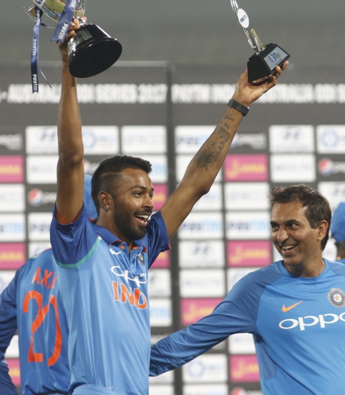 Sharma brought up his century in style, smashing Coulter-Nile for a six over mid-wicket. He continued to torment the Australian bowlers before falling to leg-spinner Adam Zampa while trying to go over the top. Kohli, who was cruising along with 39 runs off 55 deliveries, fell just three balls later when a mistimed drive into the hands of Marcus Stoinis at long off handed Zampa his second wicket of the match. India thrash Australia,India beats Australia,India thrash Australia in 5th ODI,Rohit Sharma