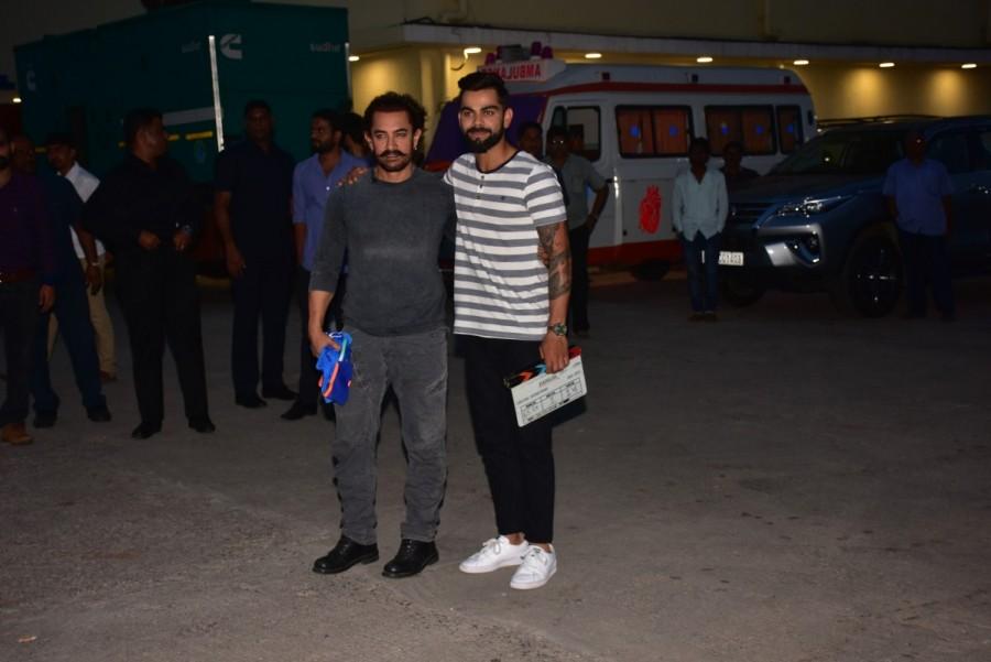Aamir Khan gifted as a memento to Virat Kohli, Dangals clapboard. It is a lesser known fact Aamir has a passion for collecting clapboards from his films. Virat Kohli also gifted Aamir a jersey of Indian cricket team. Accompanying Aamir, he had his son Azad Khan who happens to be a fan of Virat Kohli. Aamir Khan and Virat Kohli,Aamir Khan,Virat Kohli,Secret Superstar,Secret Superstar promotion,Secret Superstar movie promotion,Virat Kohli promotes Secret Superstar,Aamir Khan promotes Secret Superstar