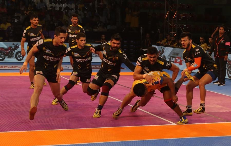 Players in action during a Pro Kabaddi League 2017 match between Tamil Thalaivas and Telugu Titans in Chennai, on Oct 3, 2017. Pro Kabaddi League 2017,Telugu Titans beat Tamil Thalaivas,Telugu Titans,Tamil Thalaivas
