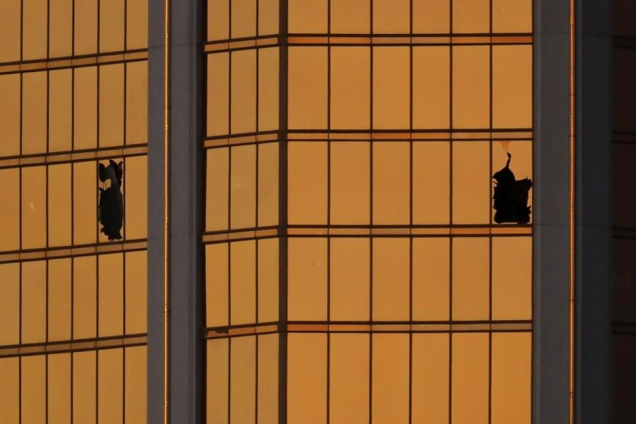Morning light reflects off the Mandalay Bay hotel and the broken windows where shooter Stephen Paddock conducted his shooting spree from the 32nd floor in Las Vegas, Nevada, U.S., October 3, 2017. Las Vegas shooting aftermath,Las Vegas aftermath,Las Vegas shooting,Las Vegas,Aftermath in Las Vegas,Las Vegas in Aftermath
