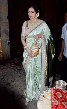 Bollywood actress Sridevi is posing for photographers during Karva Chauth celebration.