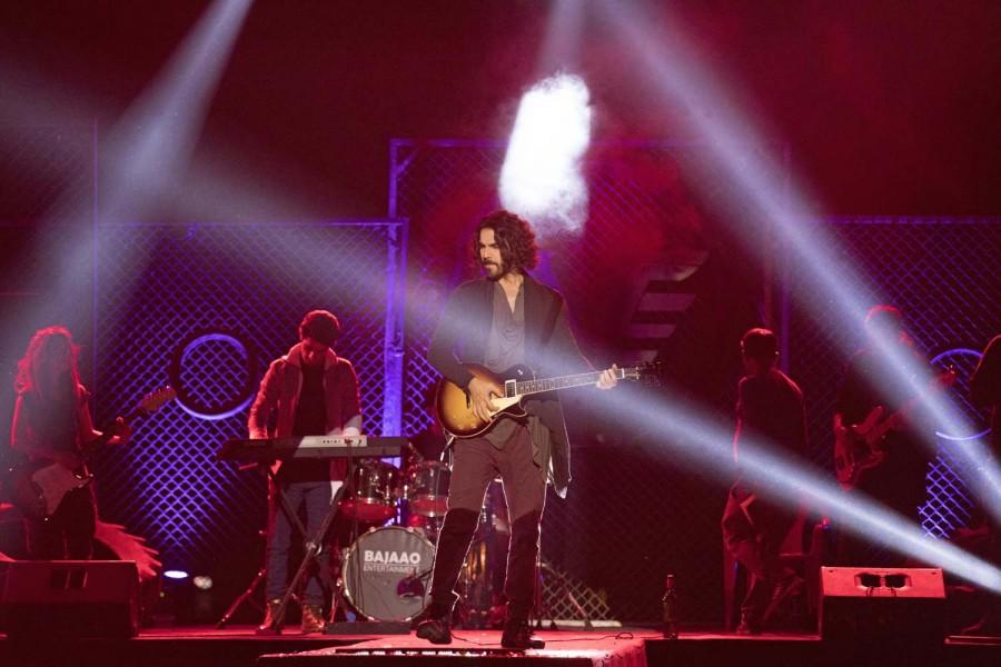 The first look of actor Karan V Grover in the role of a rockstar in Vikram Bhatt's web series "Spotlight 2", has him standing on a stage and strumming his guitar, while sporting a rugged avatar. He sports long hair and a beard for the Viu web series in which he essays a talented and successful musician who faces a downfall in his career. Karan V Grover,Spotlight 2,Spotlight 2 first look,Spotlight 2 first look poster,Spotlight 2 movie poster,Vikram Bhatt,Vikram Bhatt web series