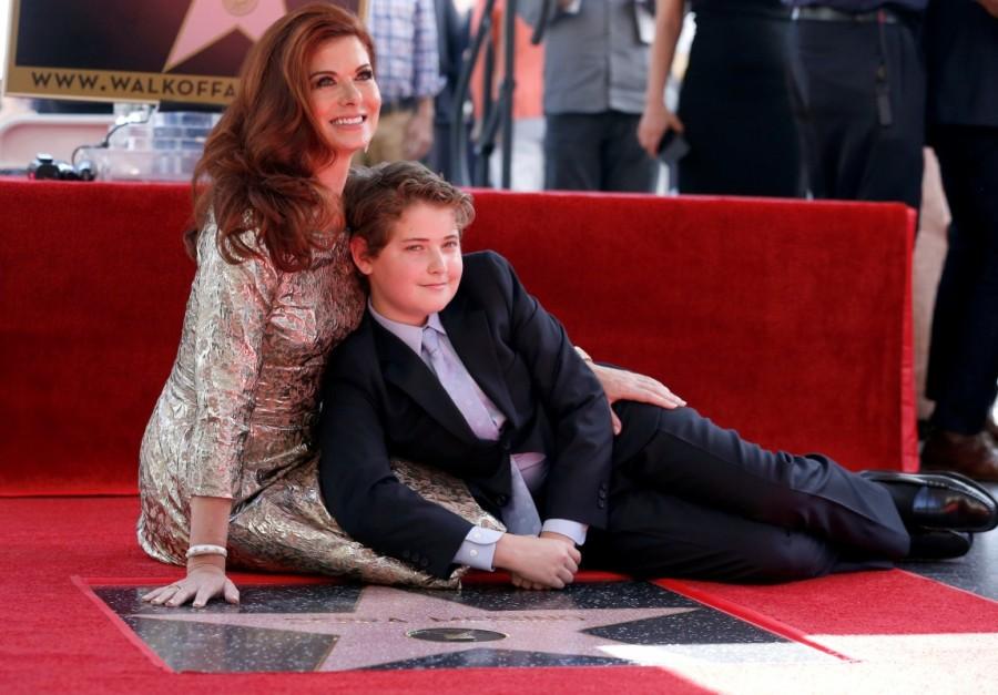 Debra Messing poses on her star with her son Roman after it was unveiled on the Hollywood Walk of Fame in Los Angeles. Debra Messing,Debra Lynn Messing,actress Debra Messing,Debra Messing gets Hollywood Walk of Fame,Hollywood Walk of Fame