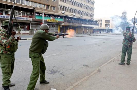 Riot policemen fire tear gas to disperse supporters of Kenyan opposition National Super Alliance (NASA) coalition, during a protest along a street in Nairobi.