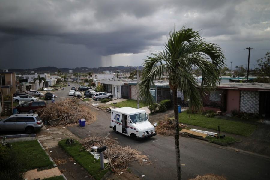 A U.S. Postal Service truck is seen at an area damaged by Hurricane Maria in San Juan. Puerto Rico,Hurricane Maria,U.S. Postal Service