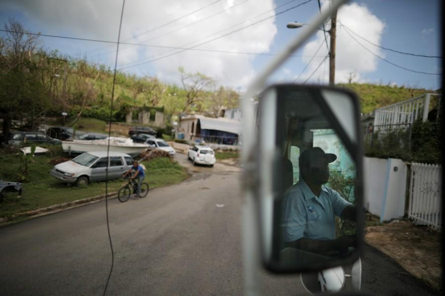 Luis Menendez, a mail man for the U.S. Postal Service, delivers mail at an area affected by Hurricane Maria in the island of Vieques. Puerto Rico,Hurricane Maria,U.S. Postal Service