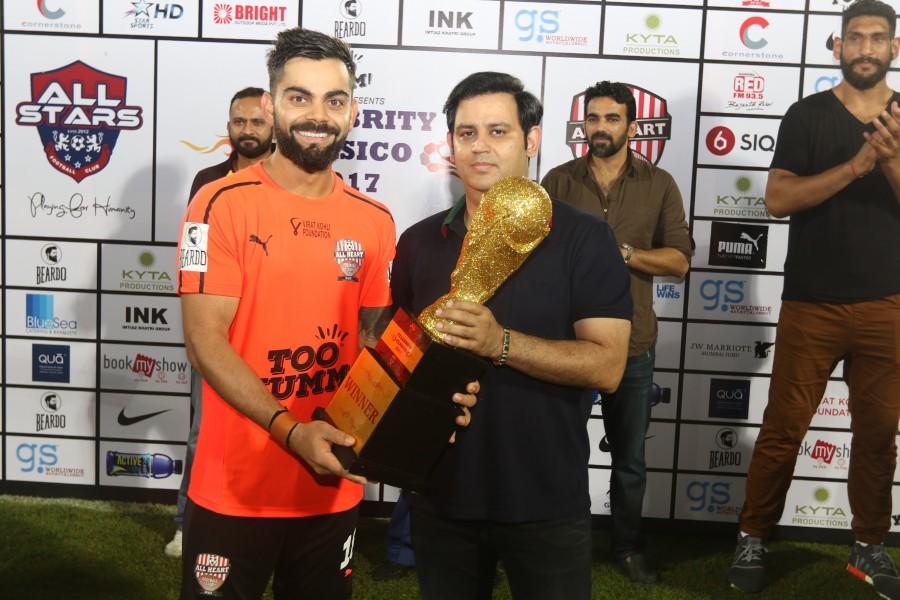 The 3rd edition of Celebrity Clasico concluded on a high note with power-packed performance from creme de la creme of the Indian entertainment industry and Indian sportsmen battling it out on the field for a noble initiative. All Heart football club walked away with a trophy of the star-studded football match held at the Andheri sports complex on the evening of 15th October. The man of the match was MS Dhoni scoring two goals for the winning team. Virat Kohli,Abhishek Bachchan,Virat Kohli and Abhishek Bachchan,MS Dhoni,Celebrity Clasico
